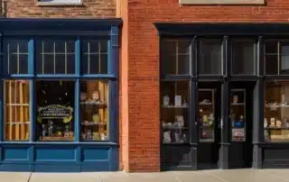 Two commercial storefronts with freshly painted blue and dark grey woodwork in Annapolis MD
