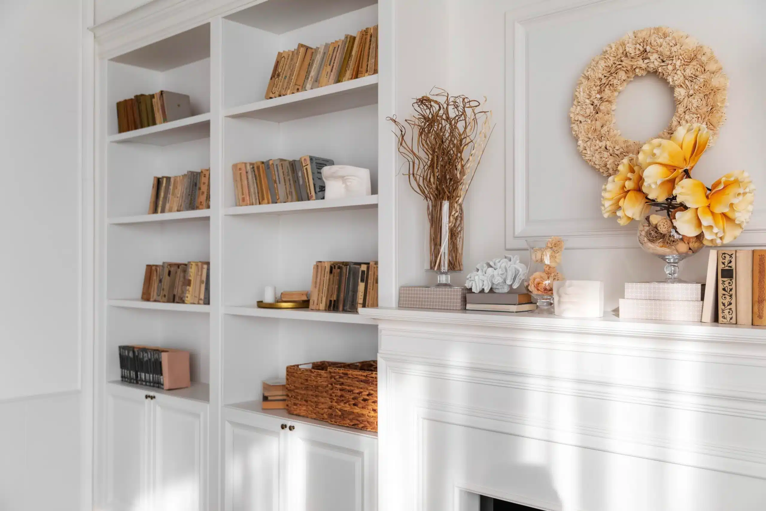 Professionally painted white built-in bookshelves and fireplace mantel in Annapolis MD