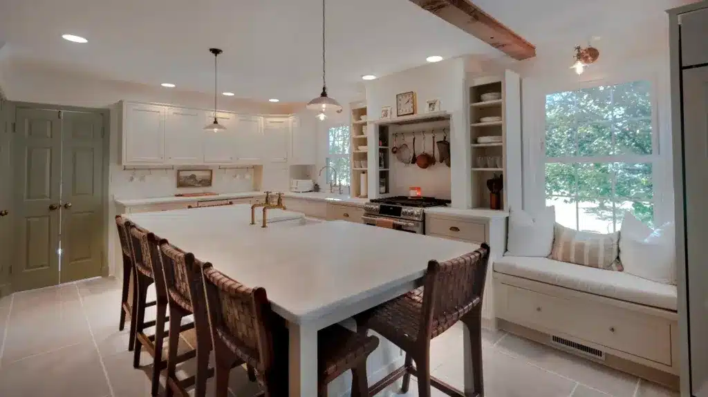 Spacious kitchen featuring a large island, custom cabinetry, and natural light