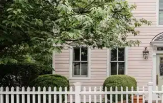 Charming pink house with white picket fence and green shutters in Annapolis MD