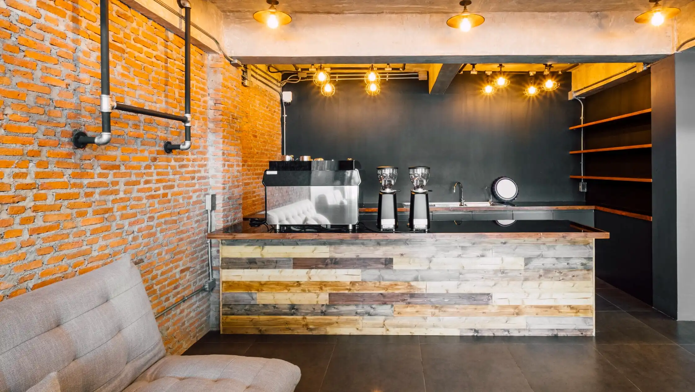 Modern industrial coffee shop bar counter with exposed brick wall and wooden finishes in Annapolis MD