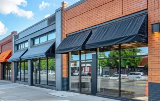 Storefront buildings with black awnings and brick facade in Annapolis MD