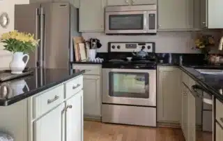 Cabinet Refinishing Sage Green Kitchen Annapolis Md Sage green painted kitchen cabinets with stainless steel appliances and hardwood floors