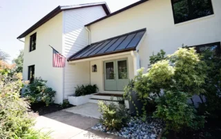 Light yellow two-story residential home with a covered entryway in Annapolis Md