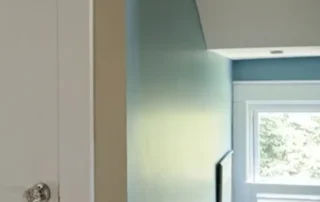 Residential Interior Painting Blue Hallway Annapolis Md Blue hallway wall next to a white door and window with shutters