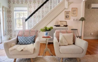 Residential Interior Painting Floral Wallpaper Annapolis Md Two cream armchairs with floral wallpaper and staircase in Annapolis Md