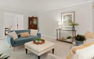 Residential Interior Painting Living Room Annapolis Md Spacious living room with neutral walls, blue sofa, and modern decor