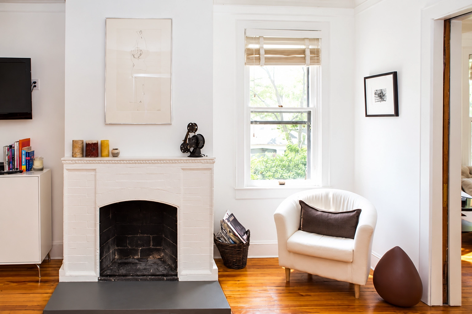 Interior Painting 1 White living room with a painted fireplace surround and cream accent chair