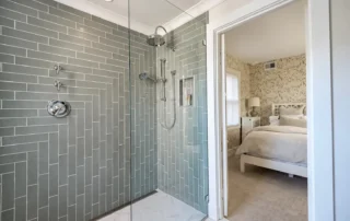 sage-gray-tile-bathroom-shower Bathroom shower with sage gray subway tiles and glass enclosure